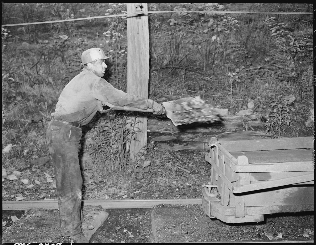 Eli Sanders, Tipple Worker, Loads Coal on Car Which Has Fallen off Cars Enroute to Tipple