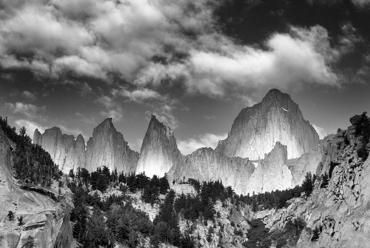 partially lit landscape mountain peaks