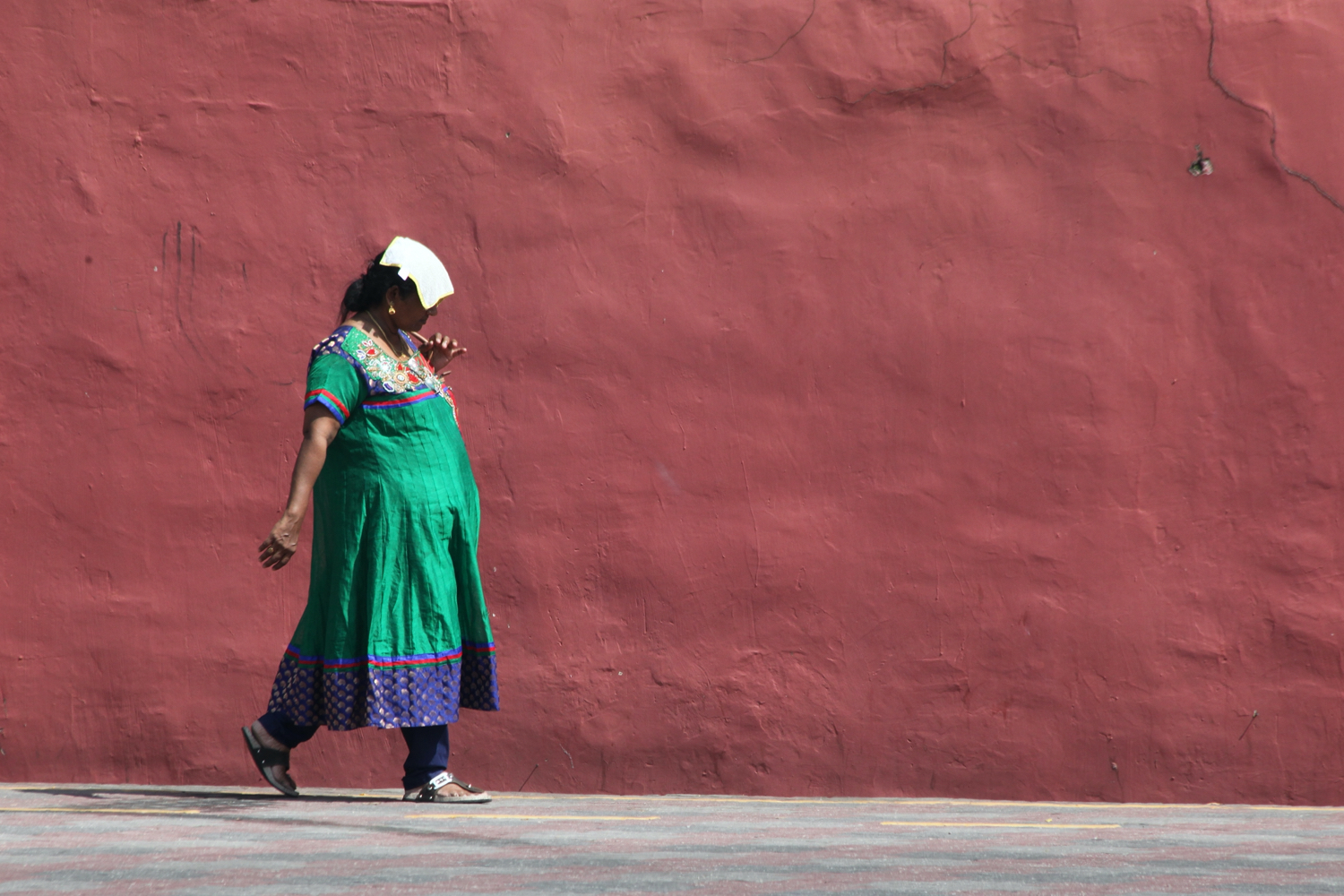 woman walking along minimalist photo