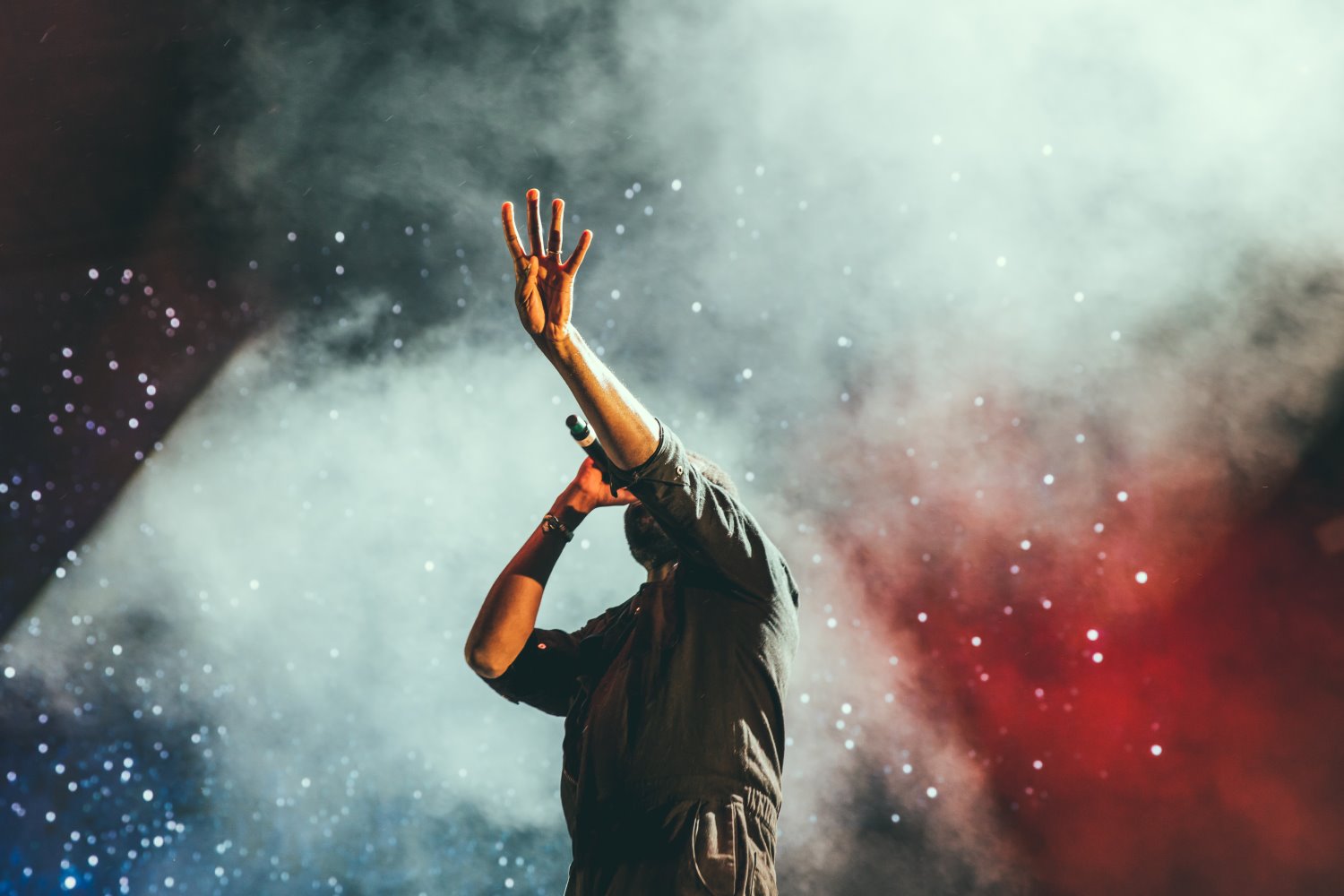 a singer at a concert with a high ISO