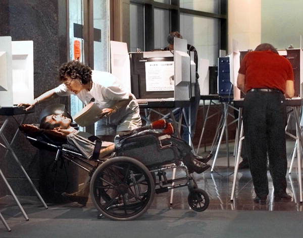 Woman assisting voter - Tallahassee, Florida