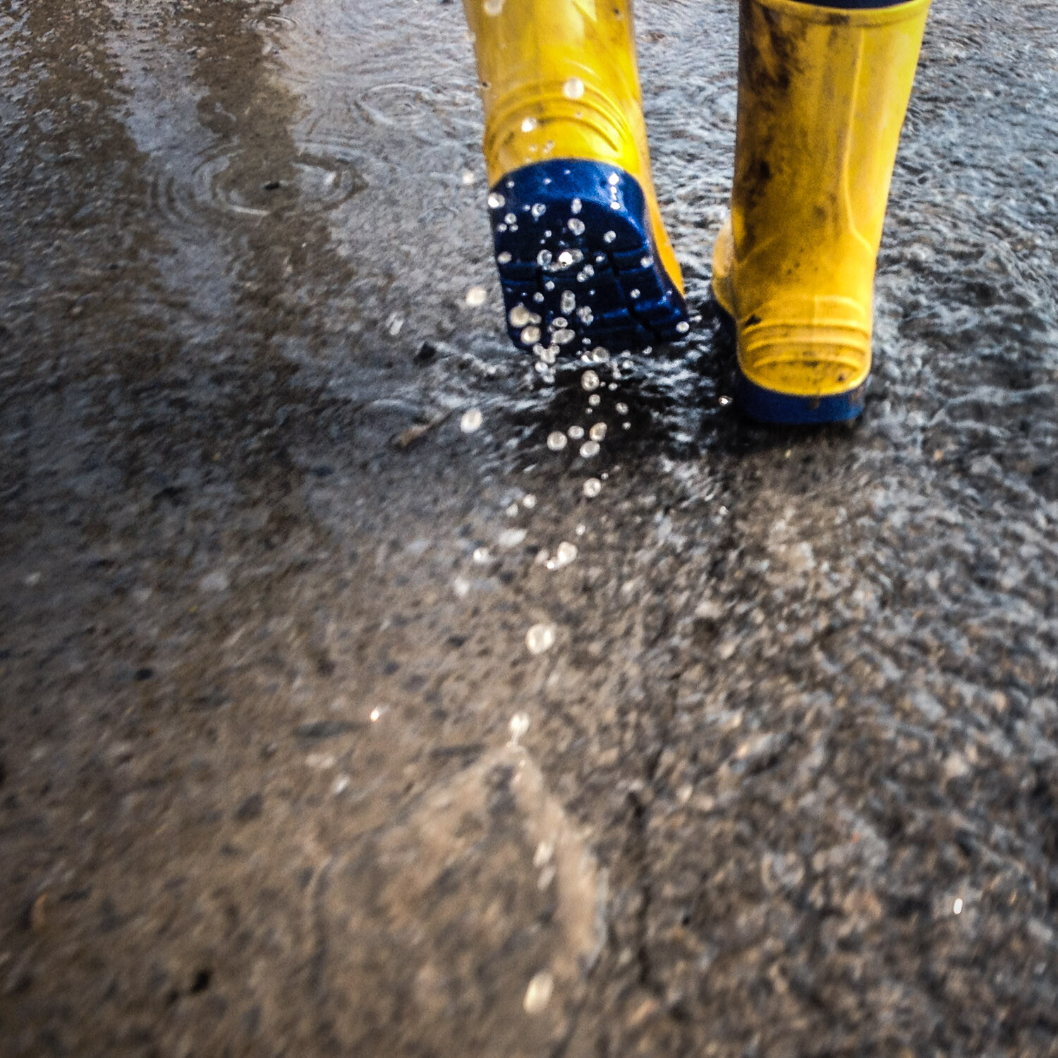 boots splashing in a puddle