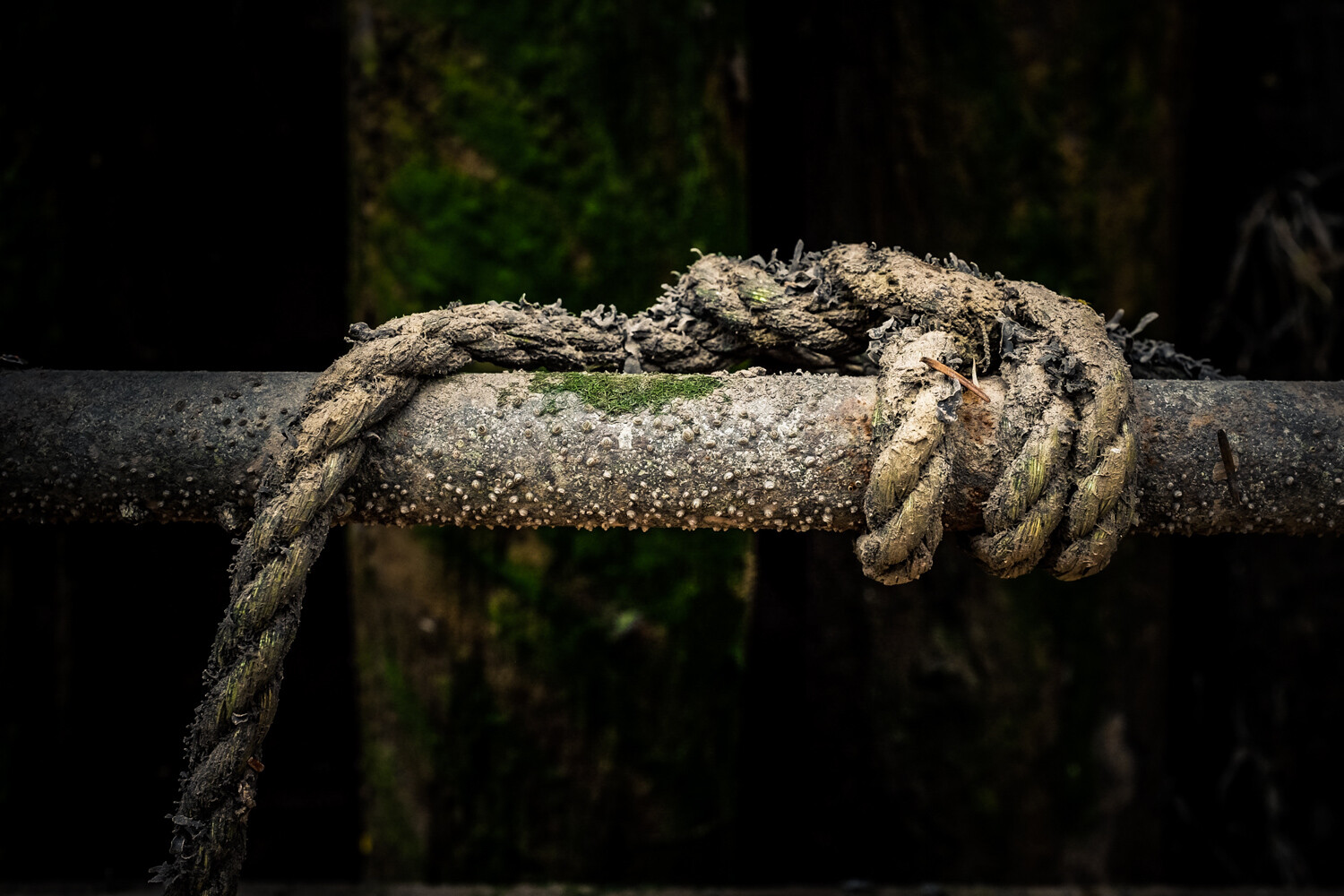 old rope on a metal pipe