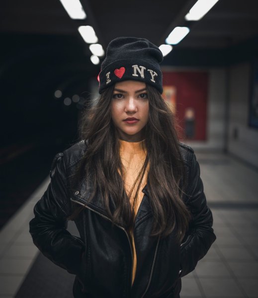 woman on a subway platform portrait shallow DOF