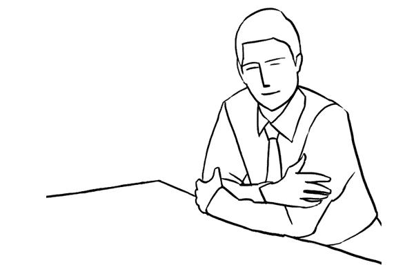 man posing at a desk