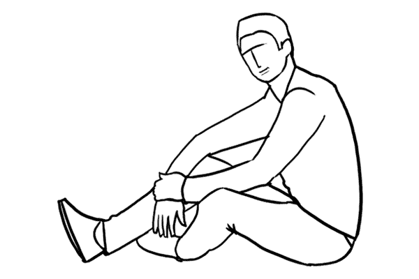 man with arms over the knees