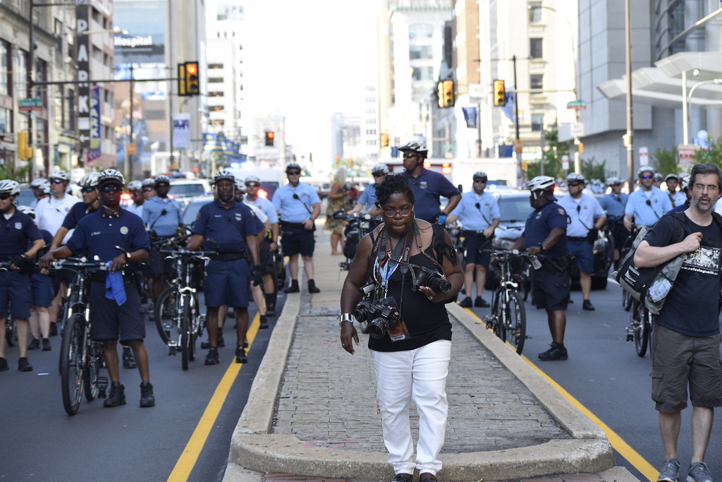 Photojournalist in front of Police Line of DNC 2016 Protests