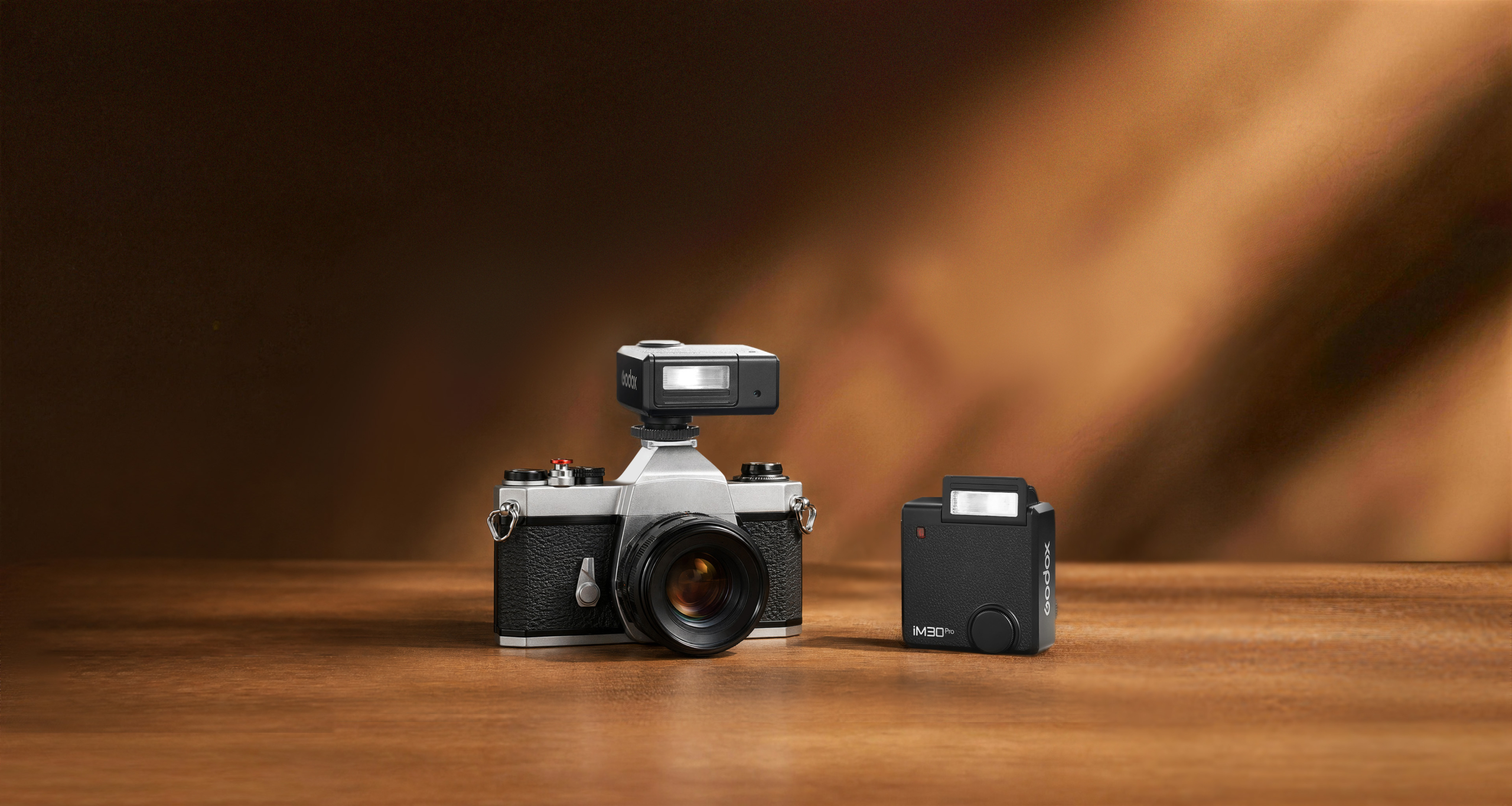 A photograph of a vintage camera with a godox im30pro flash